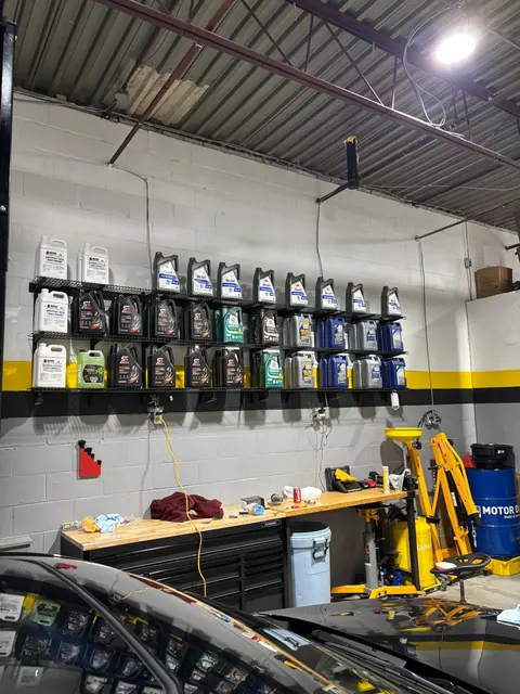 The workbench, engine hoist and oil shelf at GTS Auto Repair